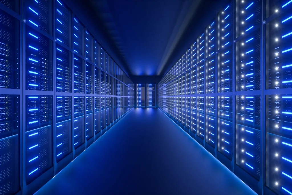 A long corridor, filled with data server computers on either side of the central walkway