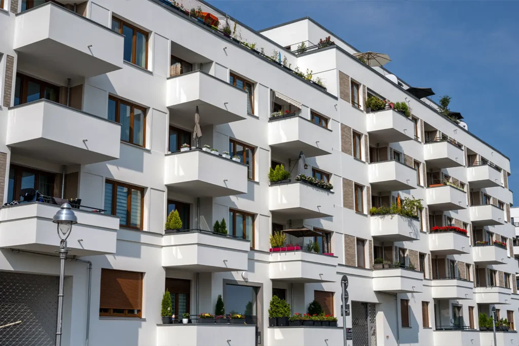 A condominium building with multiple extended balconies.