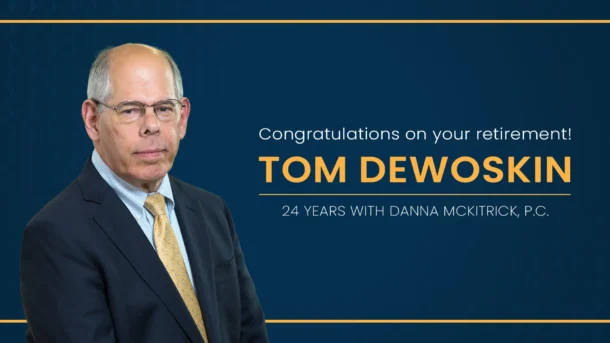 A decorative graphic congratulating attorney Tom DeWoskin on his retirement after 24 years with Danna McKitrick