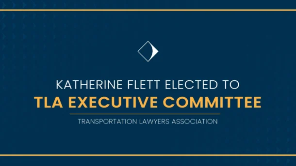 A decorative text graphic announcing Katherine Flett's election to the Transportation Lawyers Association's Executive Committee