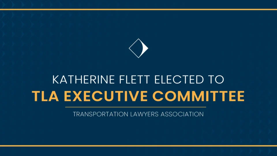 A decorative text graphic announcing Katherine Flett's election to the Transportation Lawyers Association's Executive Committee