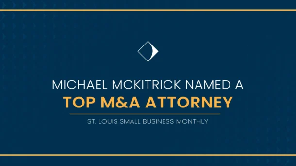 A decorative graphic reading "Michael McKitrick Named a Top M&A Attorney, St. Louis Small Business Monthly"