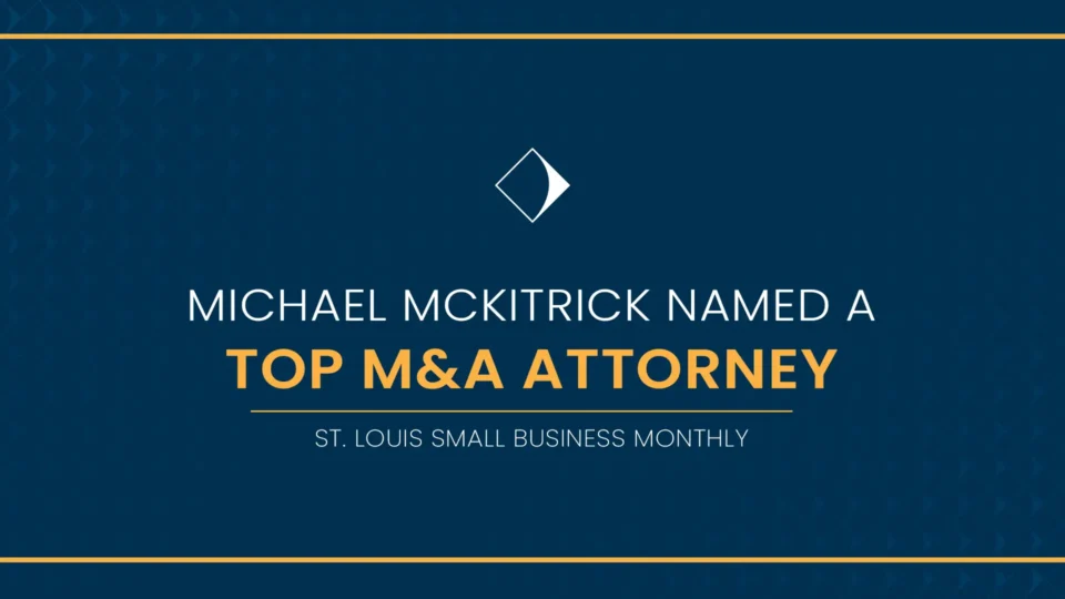 A decorative graphic reading "Michael McKitrick Named a Top M&A Attorney, St. Louis Small Business Monthly"