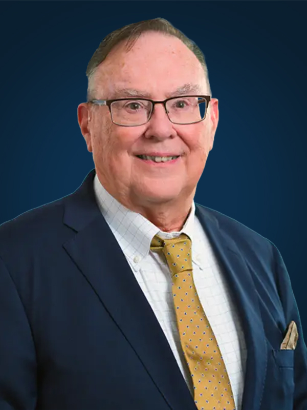 Professional headshot of attorney Michael McKitrick against a blue backdrop