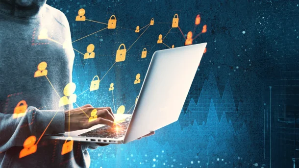 A woman holds a laptop as a series of holographic lock symbols and people icons float above the screen.