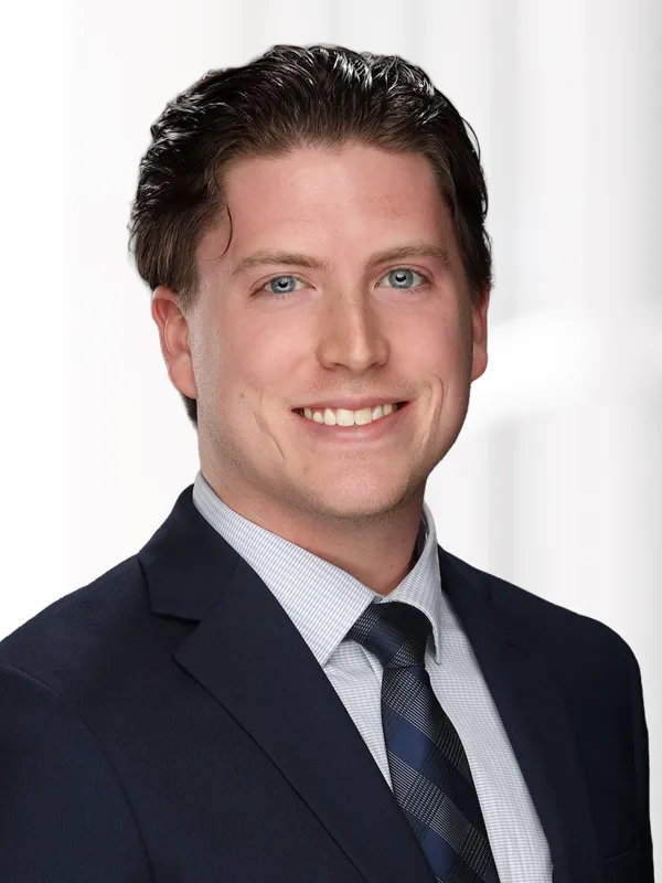 A professional headshot of associate attorney Jack Stiens on a white background