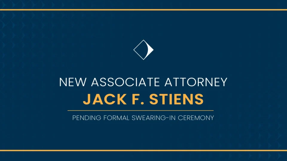 A decorative blue graphic with gold trim, reading "New Associate Attorney: Jack F. Stiens, pending formal swearing-in ceremony."